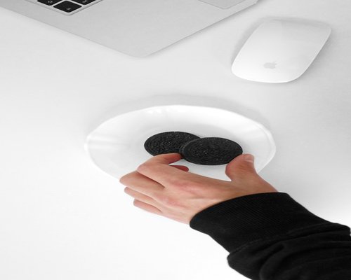 Person eating mindfully at office desk with healthy snacks